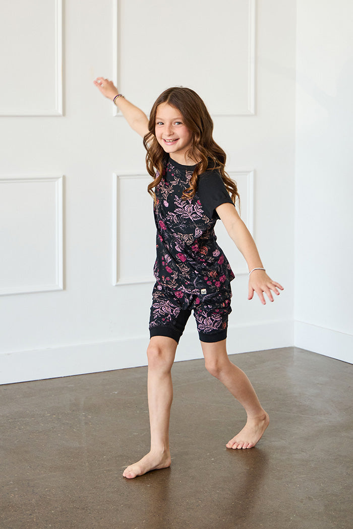 Tessa is 7 years old, 4'5" tall and is wearing a size 7/8