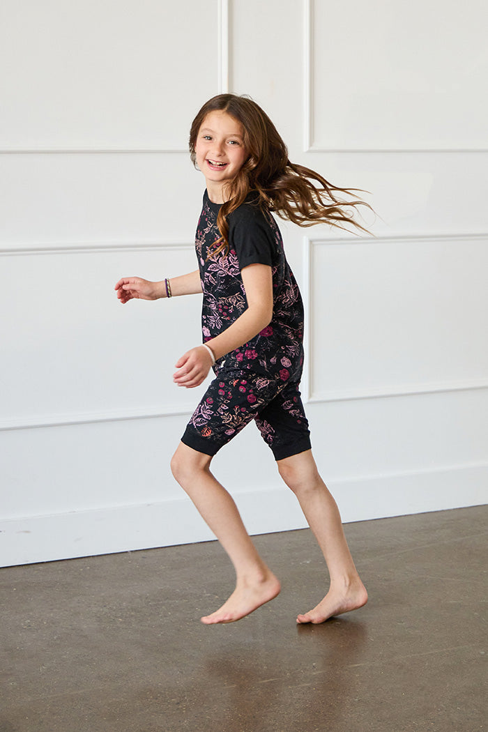 Tessa is 7 years old, 4'5" tall and is wearing a size 7/8