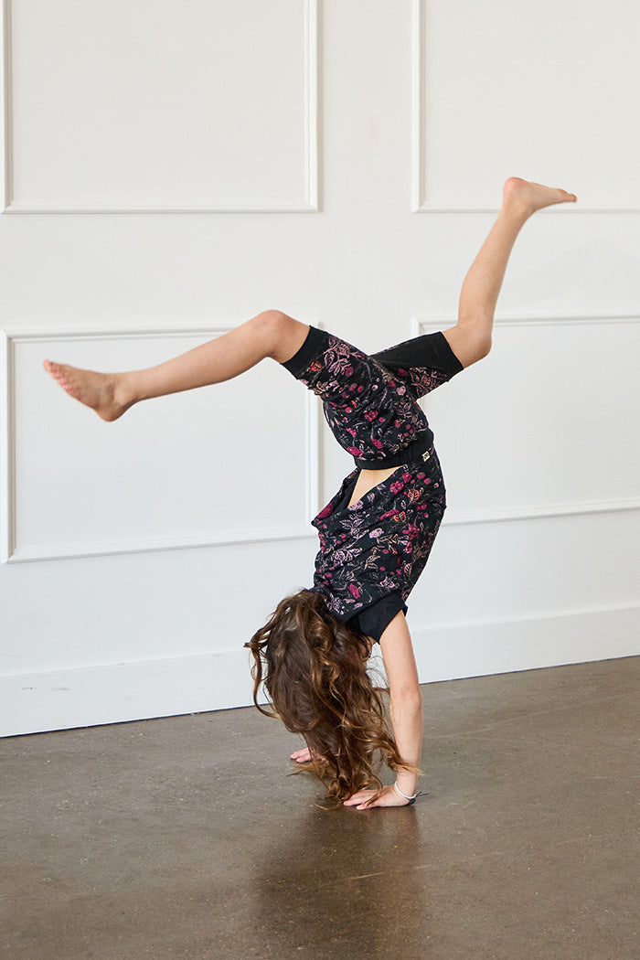 Tessa is 7 years old, 4'5" tall and is wearing a size 7/8