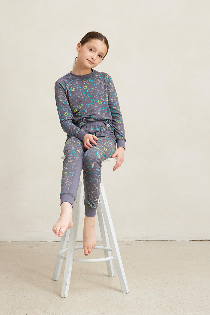 Tessa is 8 years old and is wearing a size 7/8