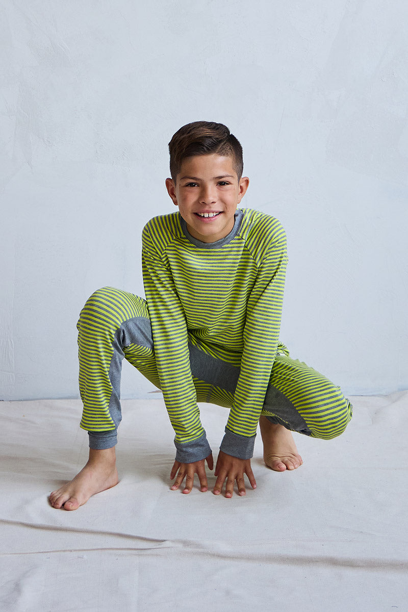 Marcus is 9 years old, 4'10" tall and is wearing a size 9/10