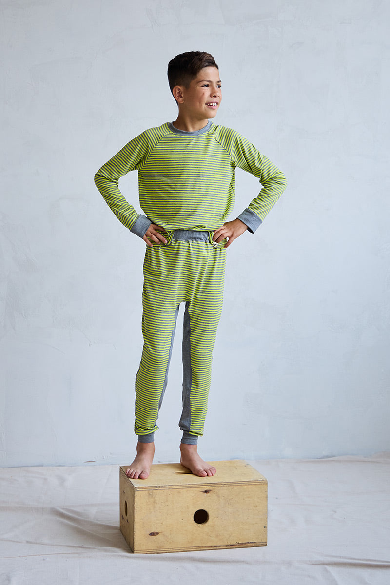 Marcus is 9 years old, 4'10" tall and is wearing a size 9/10