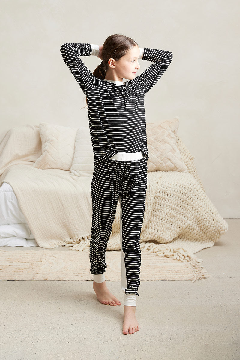 Tessa is 8 years old and is wearing a size 7/8