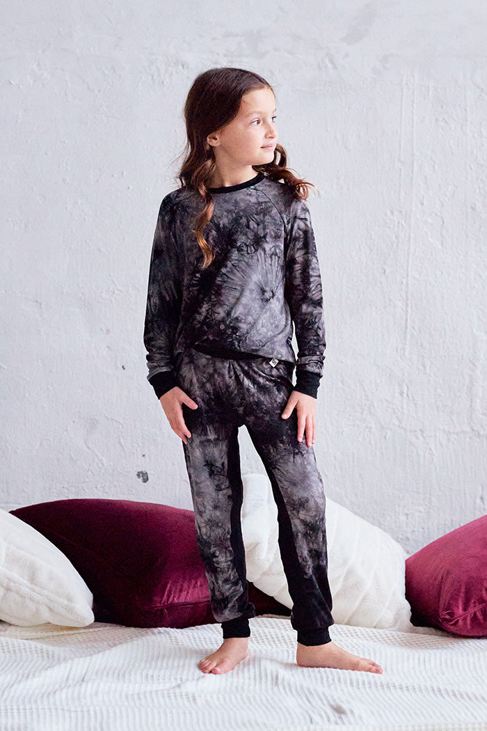 Tessa is 7 years old, 4'5" tall and is wearing a size 7/8