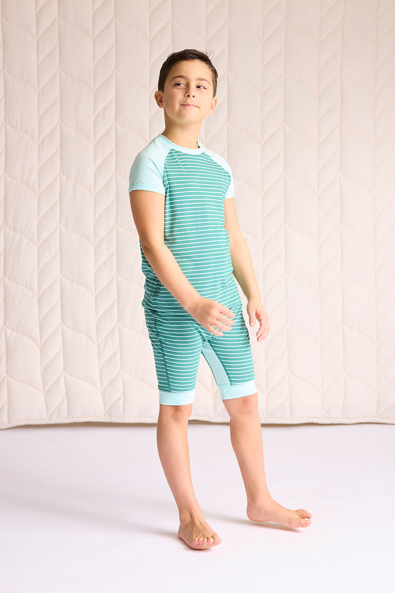 Ezra is wearing a size 7/8